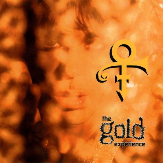 Album cover with a stylized face and 'the gold experience' text on an orange background